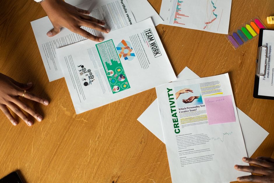 Why PDF to Word Conversion Loses Formatting (and How to Deal With It) Team members engage in a collaborative document review session, showcasing teamwork and creativity.